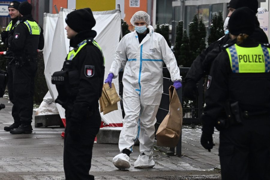 epa10513136 A Forensic police officer (C) works at the scene of a shooting in Hamburg, Germany, 10 March 2023. According to police, at least eight people died, including the suspected gunman, and several others were injured in a shooting that occurred at a Jehovah's Witness meeting hall in the evening of 09 March. Investigations into the motive were ongoing.  EPA/FILIP SINGER