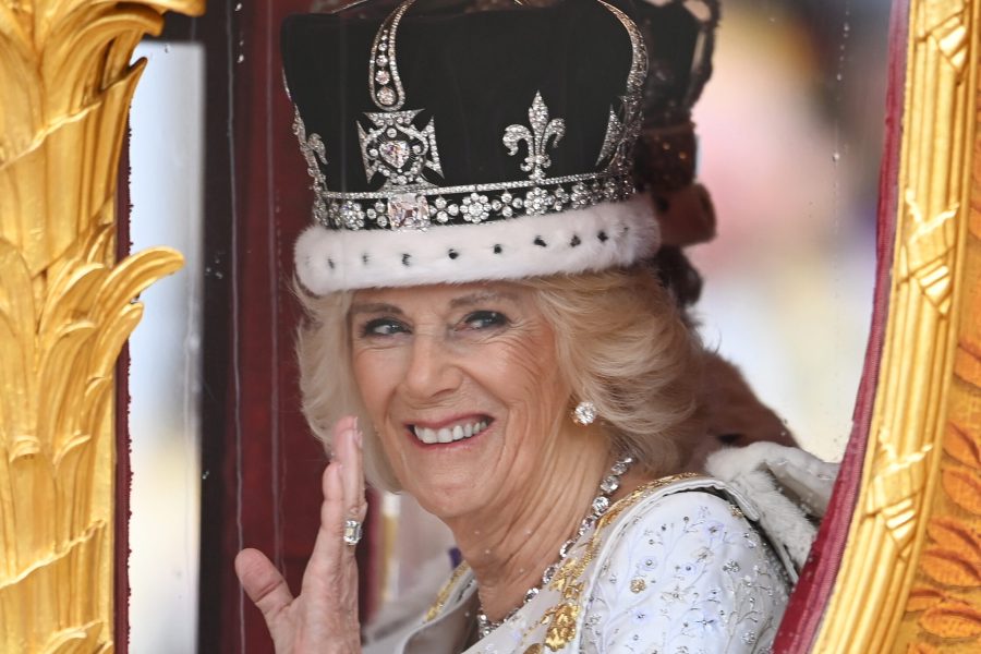 epa10611838 Britain's Queen Camilla wearing a modified Queen Mary's crown smiles and waves as she sits in the Golden State Coach after Britain's King Charles III and her Coronation at Westminster Abbey, London, Britain, 06 May 2023. Coronations of British Kings and Queens have taken place at Westminster Abbey for the last 900 years. The service was attended by around 100 heads of state from around the world.  EPA/Andy Rain