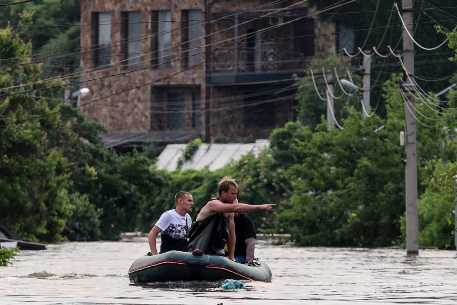 epa10678410 People use a rubber boat in a flooded street of Kherson, Ukraine, 07 June 2023. Ukraine has accused Russian forces of destroying a critical dam and hydroelectric power plant on the Dnipro River in the Kherson region along the front line in southern Ukraine on 06 June. A number of settlements were completely or partially flooded, Kherson region governor Oleksandr Prokudin said on telegram. Russian troops entered Ukraine in February 2022 starting a conflict that has provoked destruction and a humanitarian crisis.  EPA/MYKOLA TYMCHENKO