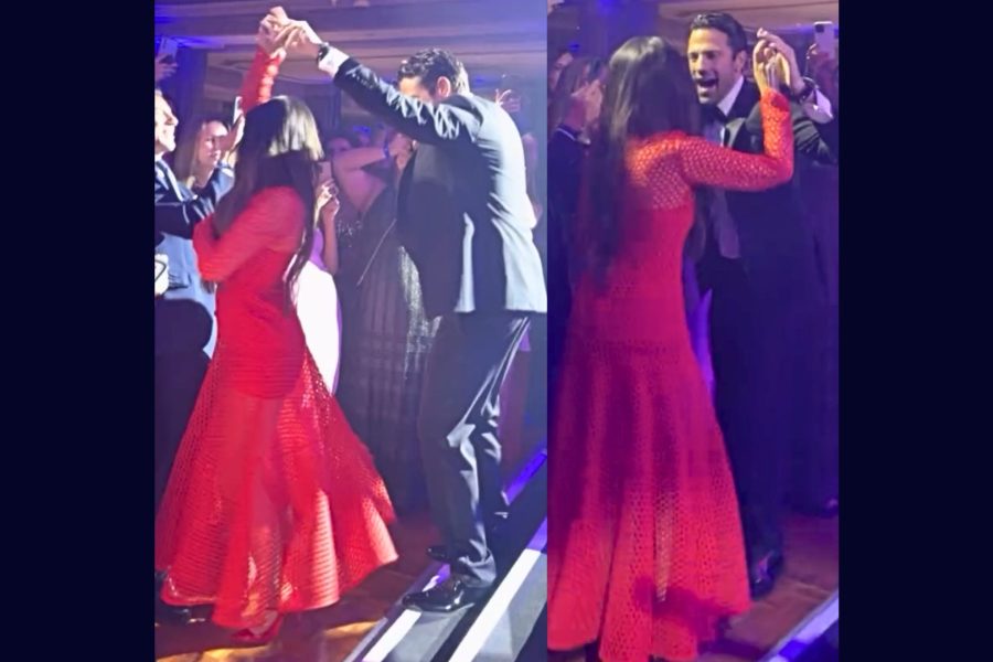 Άντρας και γυναίκα με κόκκινο μακρύ φόρεμα χορεύουν