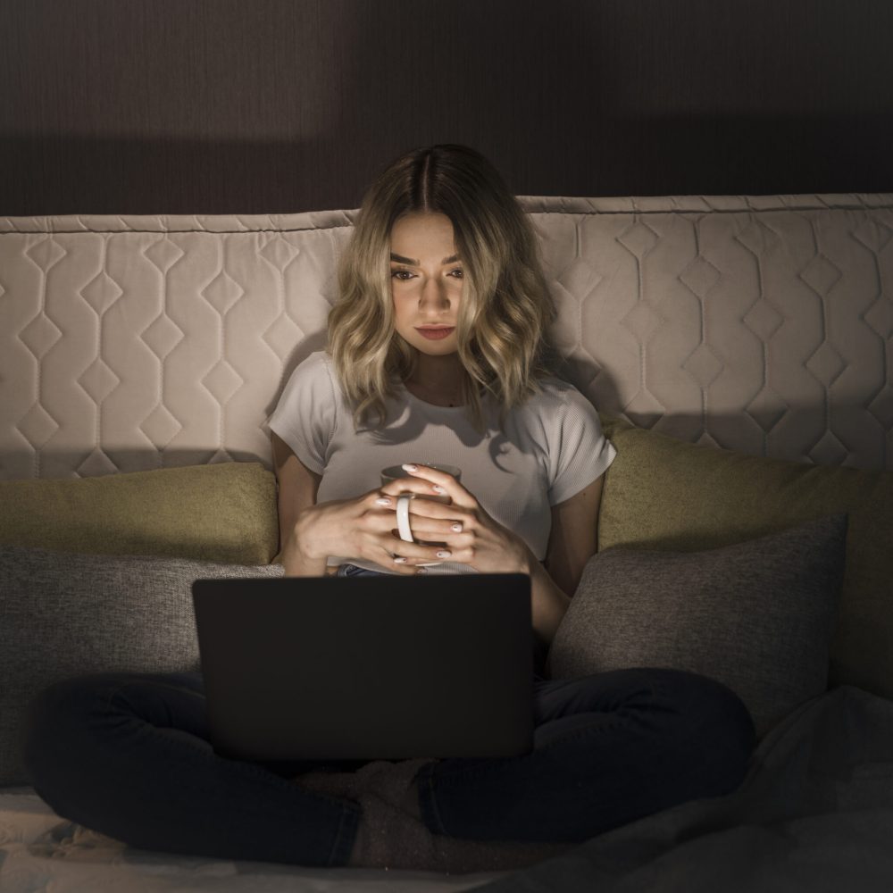 front-view-woman-sitting-bed