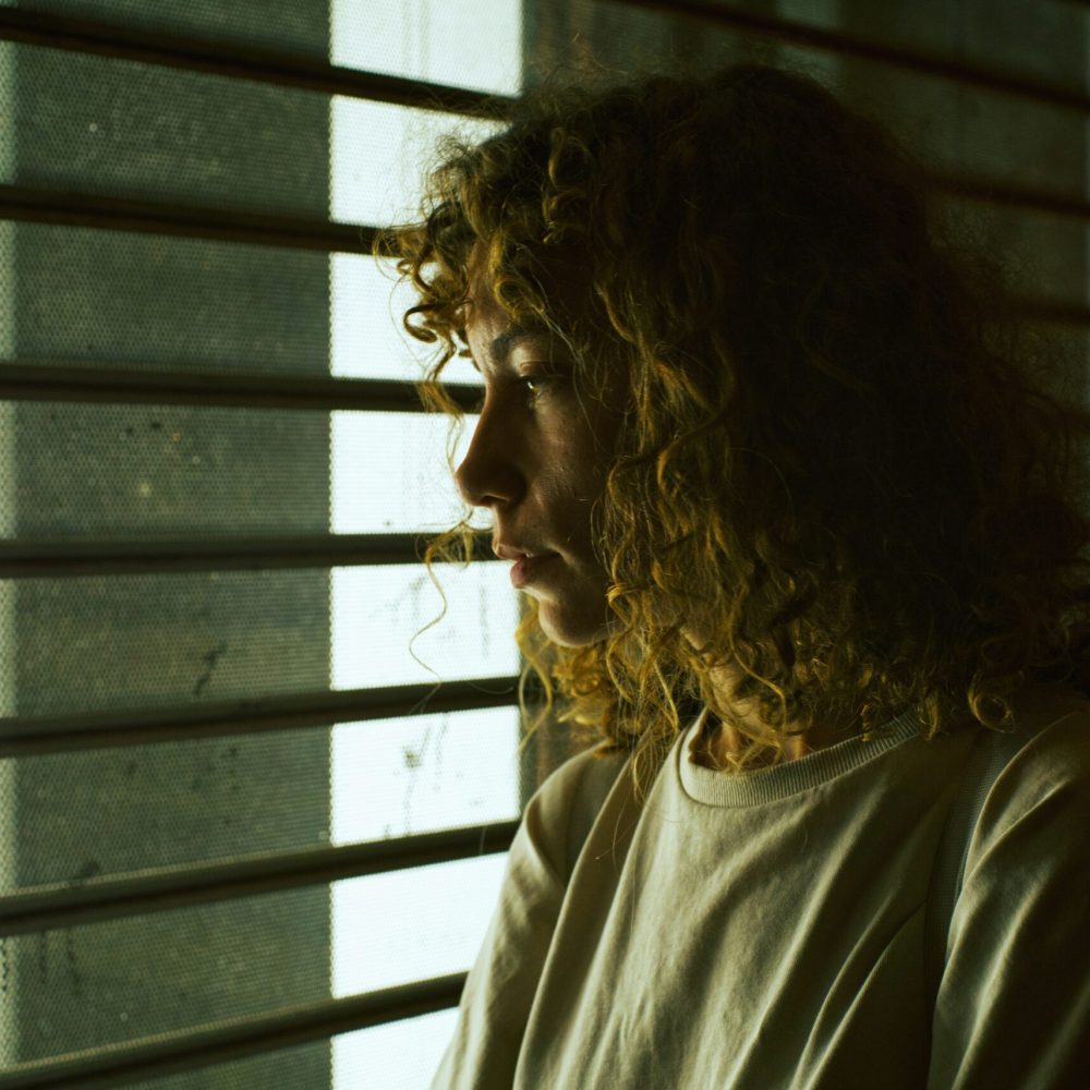 person-with-curly-hair-unsplash