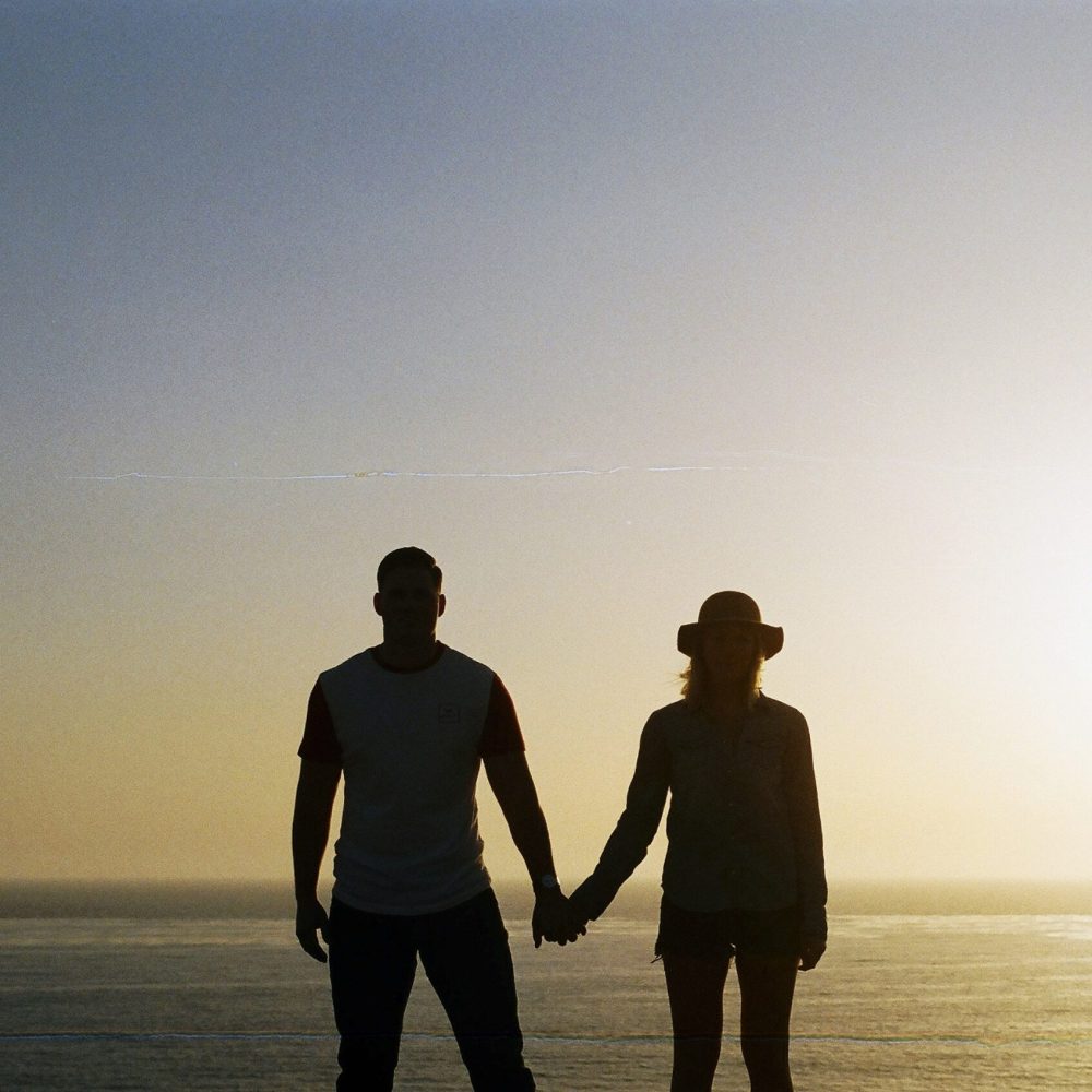 silhouette-of-couple-holding-hands-unsplash
